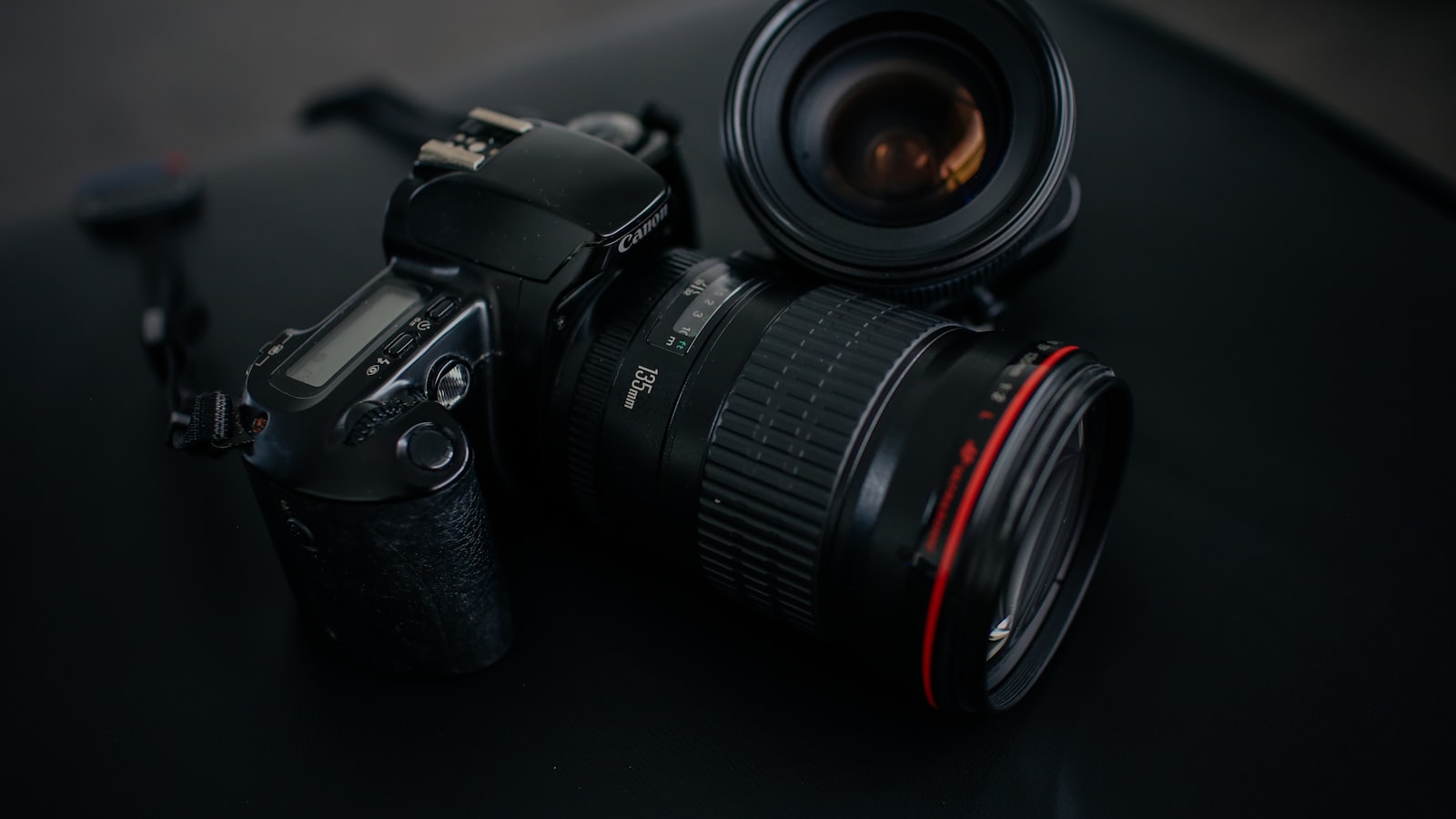 Close-up of a camera lens glass with concentric rings of reflection